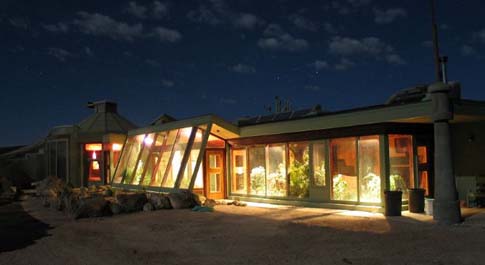 earthship at night in the desert